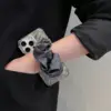Elegant Marble Phone Case with Satin Scrunchie Strap